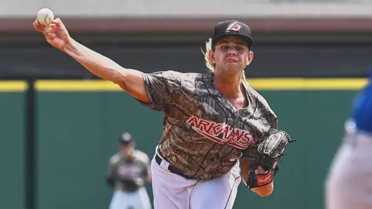 Taylor Dollard throws a pitch for Arkansas.
