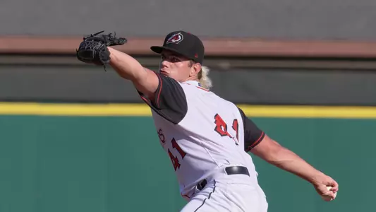 Taylor Dollard throws a pitch for Arkansas.