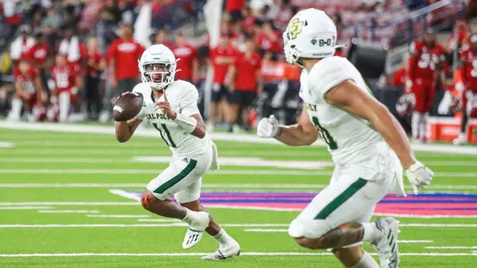 Jaden Jones rolls right, looking for Josh Cuevas.