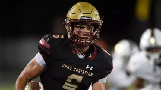 Ethan Calvert carries the ball at Oaks Christian.
