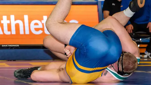Trevor Tinker pins his CSU Bakersfield opponent.