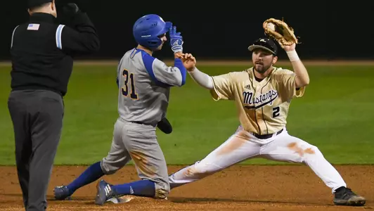 Aaron Casillas stretches to catch ball for force play at second base.