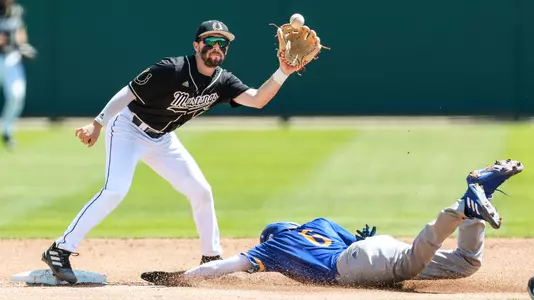 Aaron Casillas catches high throw as Anthony Mata steals second base.