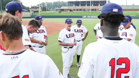 Larry Lee chats with players after a game.
