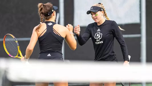 Kennedy Buntrock, Alexandra Ozerets fist bump, UC Davis, 020324