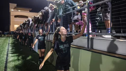 Emily Nedom high fiving crowd