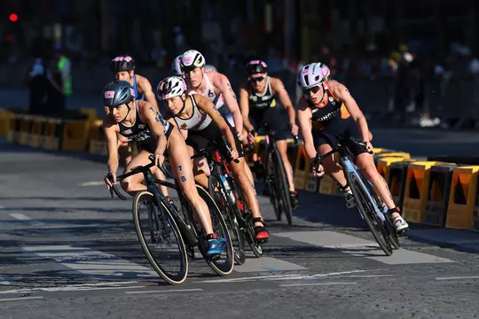 PARIS, FRANCE - AUGUST 05: Taylor Spivey of Team United States leads the pack during the Mixed Relay on day ten of the Olympic Games Paris 2024 at Pont Alexandre III on August 05, 2024 in Paris, France. (Photo by Lintao Zhang/Getty Images)