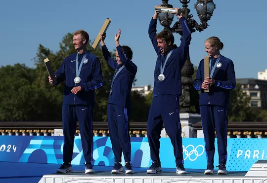 PARIS, FRANCE - AUGUST 05: Silver medalists Seth Rider, Taylor Spivey, Morgan Pearson and Taylor Knibb of Team United States celebrate the podium during the Triathlon medal ceremony after the Mixed Relay on Day Ten of the Olympic Games Paris 2024 at Pont Alexandre III on August 05, 2024 in Paris, France. (Photo by Al Bello/Getty Images)