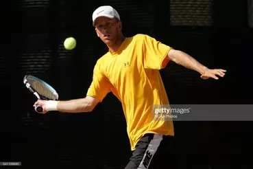 Matt Seeberger returns a serve in his Singles Championship
win at the East Tennis Courts in 2005 (Courtesy NCAA)