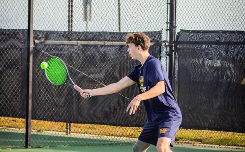 Sam Hall returns a volley