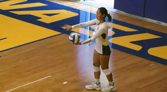 Emily Pasion prepares to serve