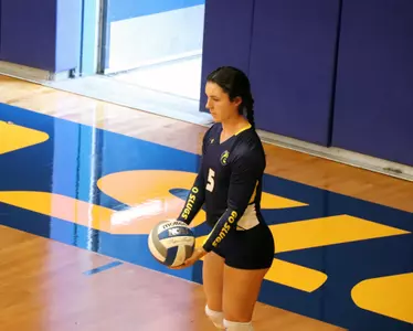 Emily Melvin prepares to serve