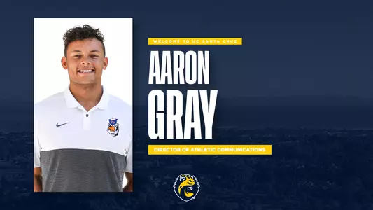 a head shot of Aaron Gray with a background of the UC Santa Cruz campus shaded in blue and overlayed with yellow text naming him the new Director of Athletic Communications.