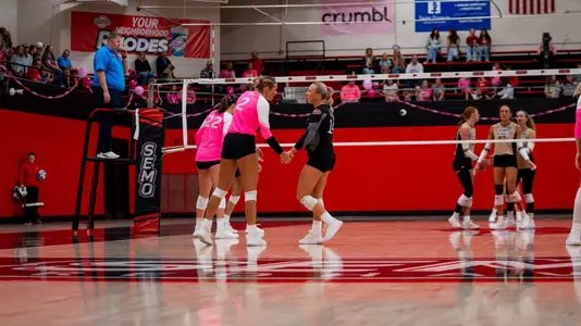 Lucy Arndt and Harper Highfill talking before a point