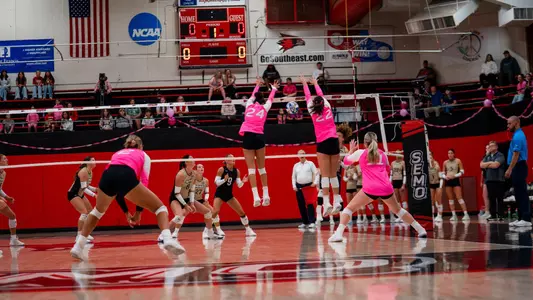 Katy St. John and Alaina Lester teaming up for a block on the attack