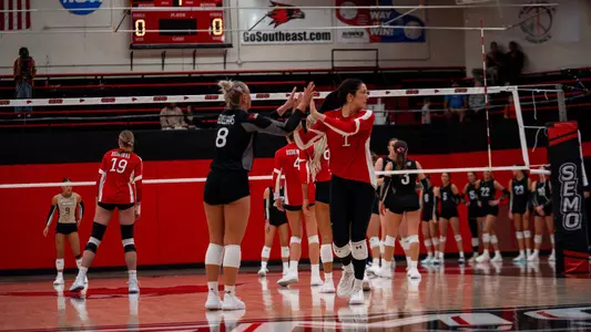 Nina Schuberth and Holland Guilliams high five in-between points
