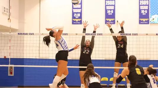 Katy St. John and Alaina Lester forming a wall in front of the opponents attack