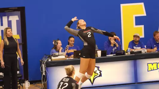 Lucy Arndt up high for the serve