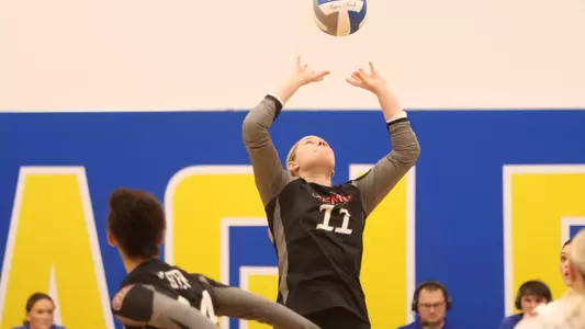 Megan Holder sets the ball for the attack from Lester