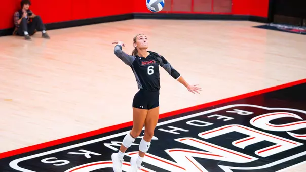 Ellie Burns serves