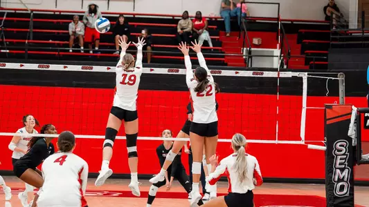 Katy St. John and Jacey Young team up to form a blocking wall