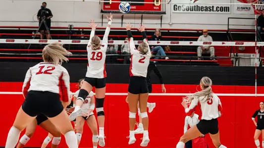 Jacey Young and Lucy Arndt eye to block the attack