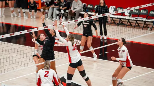Jacey Young poses blocking threat in the middle blocker position