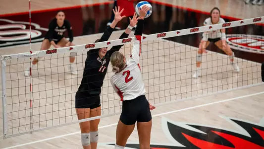 Lucy Arndt goes cross court for a kill
