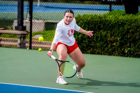 Juliette Demunck reaching for a cut backhand against Bryant
