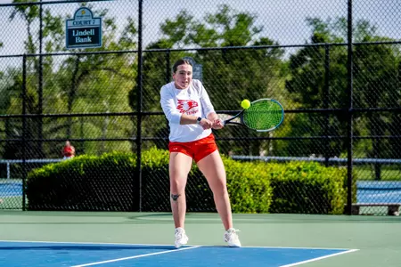 Juliette Demunck going down the line with a backhand