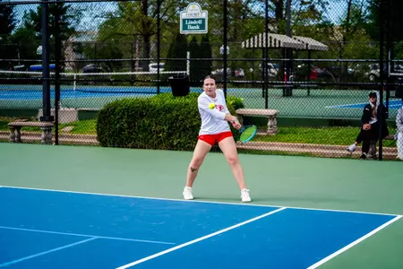 Juliette Demunck eying down the ball ready to rip a backhand