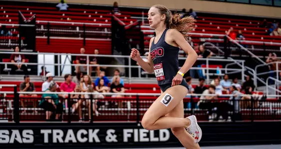 Kale Clements running down the straight to finish her race