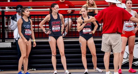Teammates Erika Mellor and Kale Clements get pre-race instructions