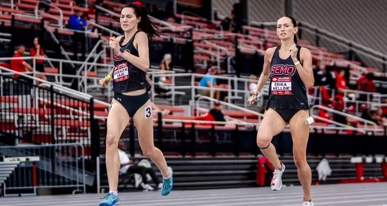 Erika Mellor chases down teammate Madalyn Gray at the end of the 800m race