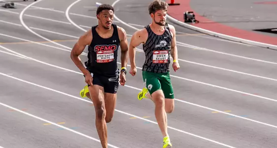Jon'David White passes an opposing runner on the back straight