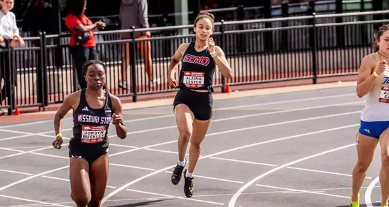 Alaina Lester turning the corner and looking to pass her opponents