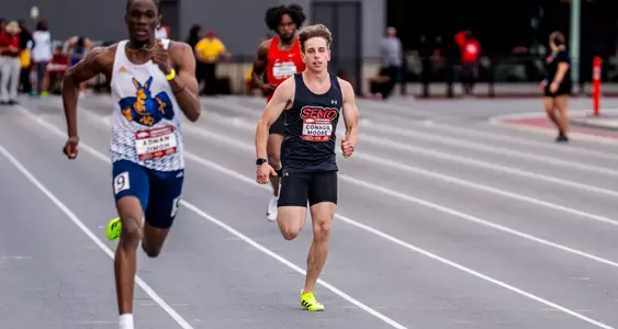 Conner Moore chasing down another runner in his 400m race