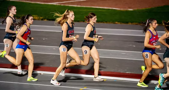 Kayla Vogelsang and Brooklyn Bender run in a pack during their distance race