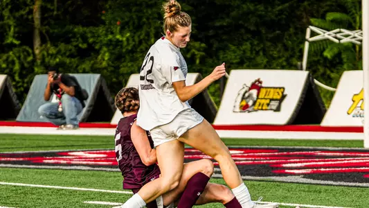 Grace Sabatka gets tackled in the box