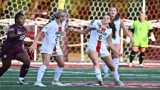 Carla Vizuete and Riley Henderson fight for possession against SIU