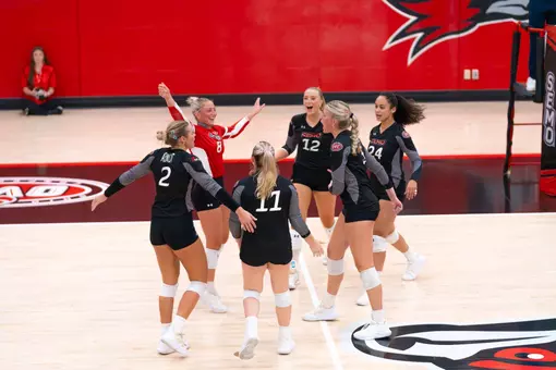Volleyball team celebrates a point