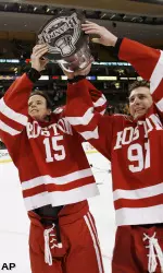 Senior co-captains John McCarthy and Matt Gilroy hoist the Beanpot after the Terriers' 5-2 victory.