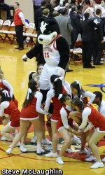 BU cheerleaders perform at a men's basketball game with Rhett.