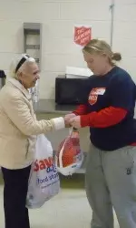 BU women's lacrosse players distributed Thanksgiving dinners to the needy on Saturday