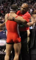 Taffur is congratulated by head coach Carl Adams after advancing to the quarterfinals.