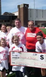The BU Student-Athlete Advisory Council presented head coach Liz Robertshaw with a donation for the Terriers' annual Friends of Jaclyn game.