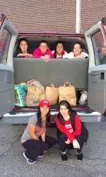 The Boston University golf team participated in a food drive for the charity Blessings in a Backpack,