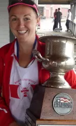 Senior Mackenzie Wiler with the Patriot League Championship trophy