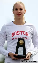 Barwise accepts her trophy after a sixth-place finish in the high jump.