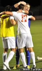 No. 17 Lucas McBride is greeted by his teammates after scoring the game winner.
